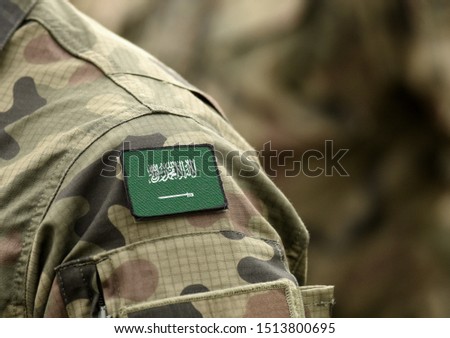Flag of Saudi Arabia on military uniform (collage).  Royalty-Free Stock Photo #1513800695