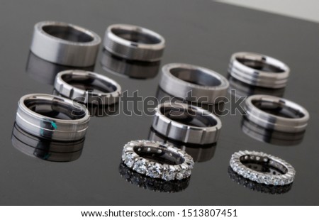 weddimg bands rings on black background