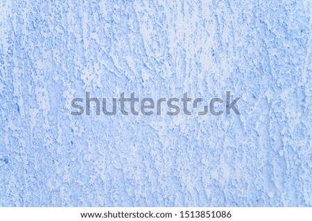Rough texture of abstract decorative light blue background of plaster wall.