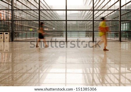 image of People silhouettes at morden office building  