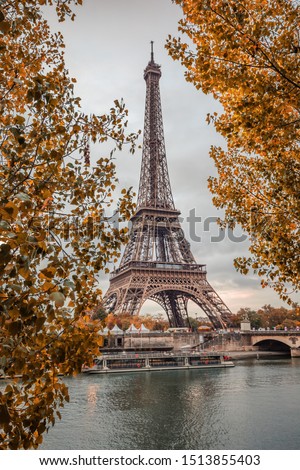 Eiffel Tower and the Seine surrounded with Autumn leaves on a Fall day