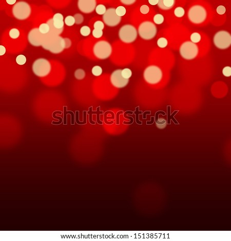 Golden sparkles on red background with bokeh effect. Ideal for Christmas.