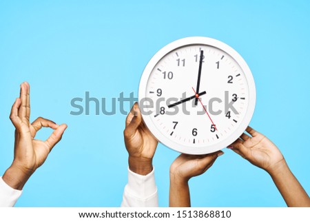 man and woman holding clock freedom holiday fun waiting