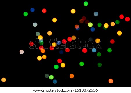 multicolored round bokeh on black background