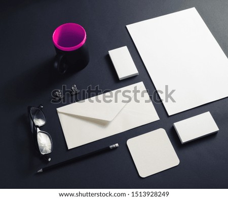 Corporate identity template. Blank stationery mock up on black paper background.