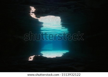 Underwater inside a cave on the seashore, natural scene, Mediterranean sea, Spain, Cabo de Gata Nijar natural park, Almeria, Andalusia