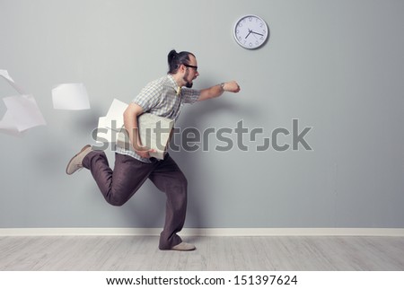 Stressed business man rushing in the office Royalty-Free Stock Photo #151397624