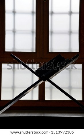 silhouette in the window of a mosque

