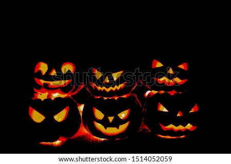 pumpkin background Halloween. happy Spooky scary pumpkin head or jack lantern smiley funny horror magic face soft focus glow in the dark background with bokeh of cross shape. October Halloween design