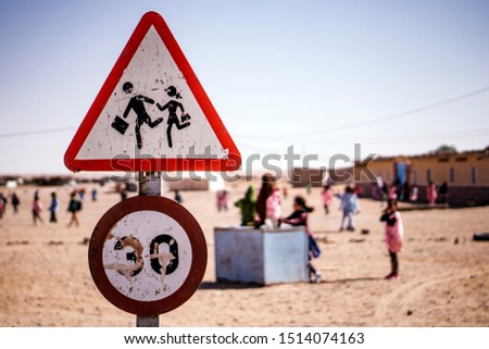 traffic sign in a refugee camp school