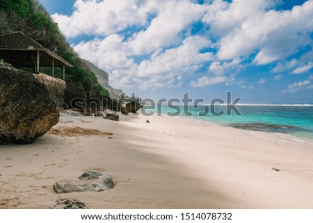 Tropical beach with sand and blue ocean at paradise island