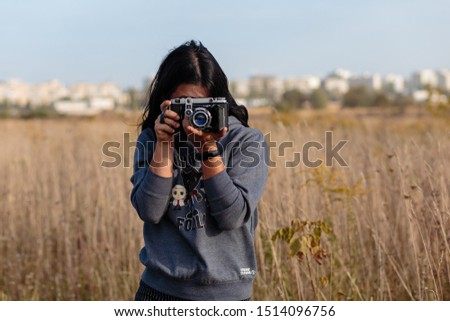 Girl photographer in the field