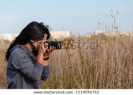 Girl photographer in the field
