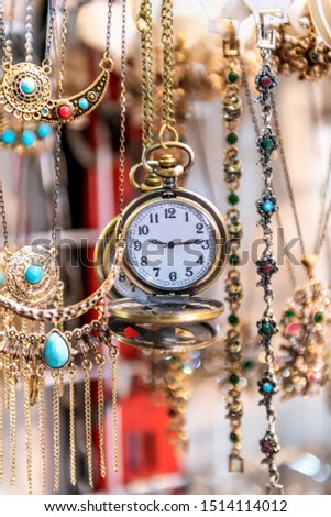 Classical Pocket Watch Hanging Up From The Keychain Strap and jewelry
