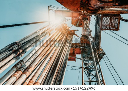 Drilling rig in oil field for drilled into subsurface in order to produced crude, inside view. Petroleum Industry Royalty-Free Stock Photo #1514122496