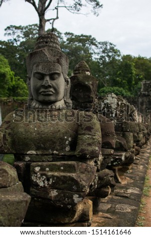A picture of a face in the walls of the temple ruins in Angkor Wat in Cambodia
