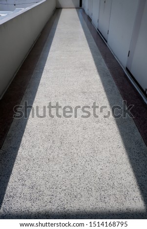 Picture of a pathway with shadows of sunlight.