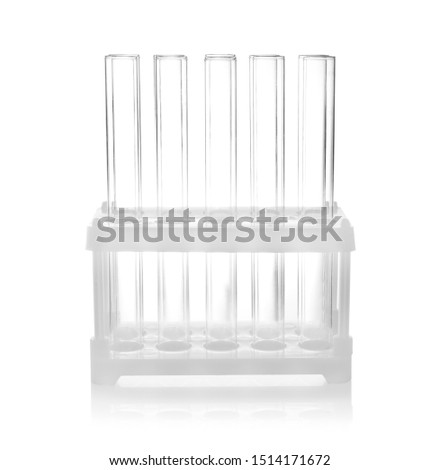 Holder with empty test tubes on white background. Laboratory glassware