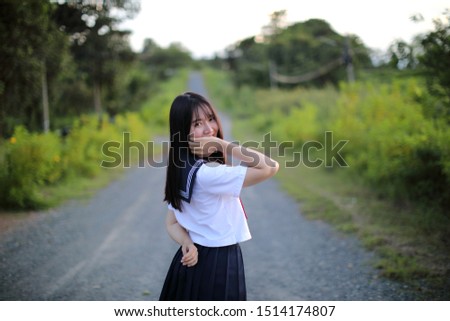 Portrait of asian japanese school girl costume looking at park outdoor 