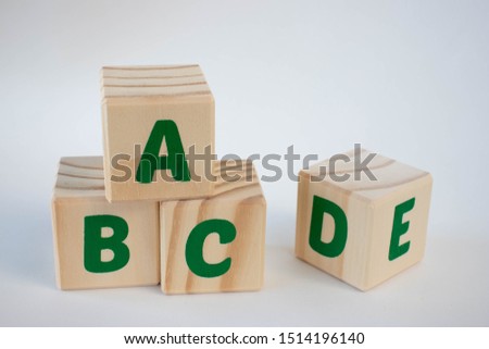 A pile of wood letter blocks on a white background