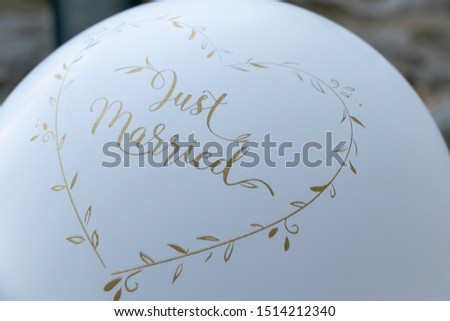 close up of white wedding balloon with design of big heart and the word just married for celebration the wedding party. 