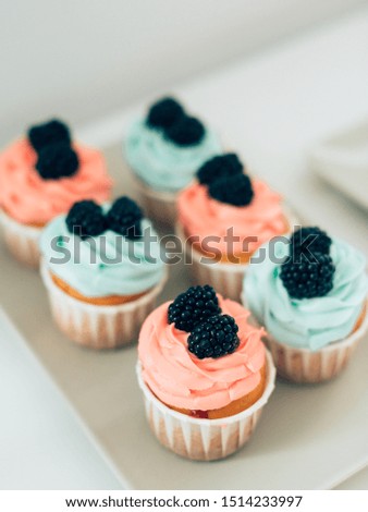 Beautiful colorfull tasty cupcakes with berries