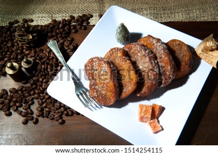 Brazilian french toast. Rabanada .Traditional dish of brazilian christmas dinner. Known as golden slice in Portugal. Dark background. Seen from above. Horizontal Royalty-Free Stock Photo #1514254115