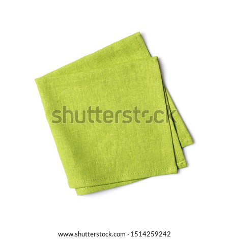 Top view of single folded green linen serviette isolated on white background Royalty-Free Stock Photo #1514259242