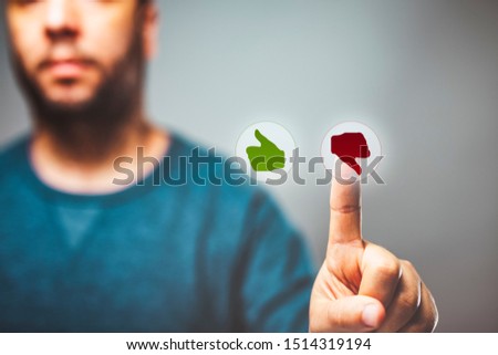 closeup of a man voting dislike - Like or unlike, reputation management, rating concept,feedback Royalty-Free Stock Photo #1514319194