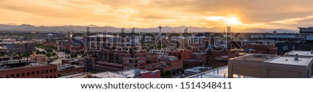 Panorama from downtown Denver looking over landmarks and with the mountains in the background