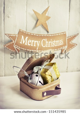 " Christmas" and "happy new year" postcard in vintage style/Christmas decoration in suitcase/hipster christmas background