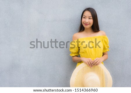Portrait beautiful women smile happy with concrete background