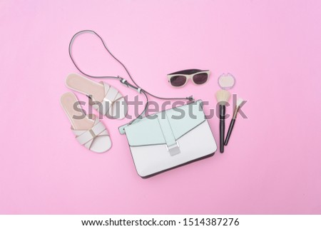 Woman fashion accessories Set. makeup cosmetics and accessories on pink background flat lay


