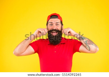 Moustache grooming guide. Hipster handsome guy touching moustache. Tips for growing and maintaining moustache. Cool and stylish. Man bearded hipster twisting mustache yellow background. Barber salon.