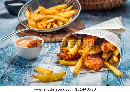Fish & Chips served in the newspaper Royalty-Free Stock Photo #151440560
