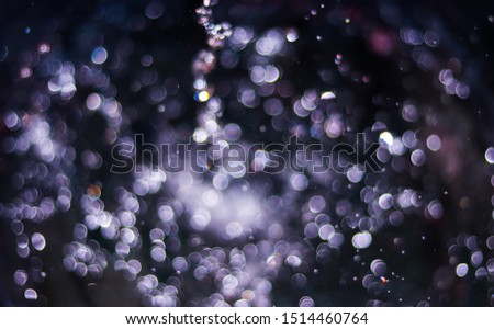 Bokeh that is made with many small drops of water. Drops of water in a circle of various sizes, with sparkling light. Used as an illustration And the background image