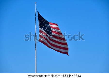 American flag under a perfect blue sky.
Old Glory