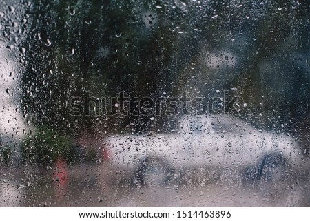 Rain drops on window glasses surface Natural Pattern of raindrops isolated on cloudy background.