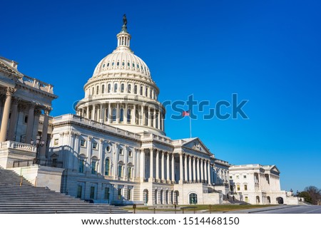 US Capitol over blue sky Royalty-Free Stock Photo #1514468150