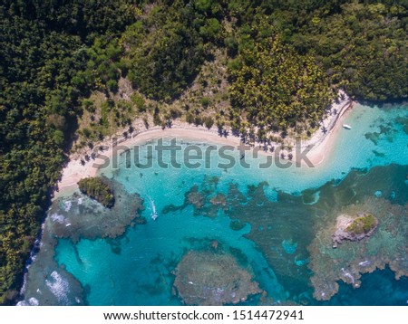 Aerial shots of a very secluded and virgin beach called Playa Ermitaño, in the island of Dominican Republic, in the Caribbean sea.
