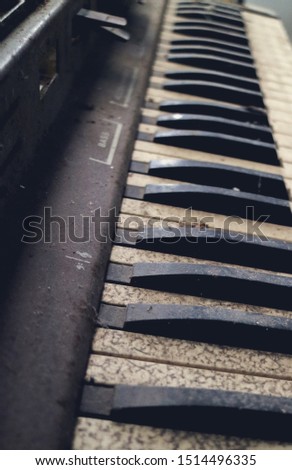 The piano vintage with electronic dilapidated in storage room