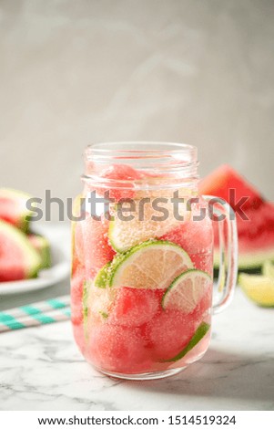 Tasty refreshing watermelon drink on marble table