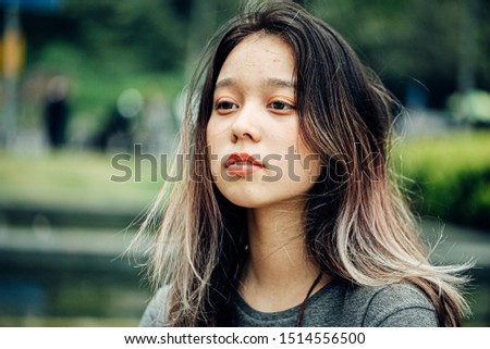 portrait of chinese teenager in park