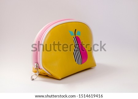 

one yellow cosmetic bag for girls