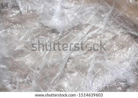 Clear transparent plastic bag texture background. Waste recycling concept. Crumpled polyethylene and cellophane.