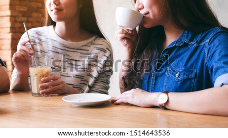 Closeup image of people enjoyed drinking coffee together in cafe