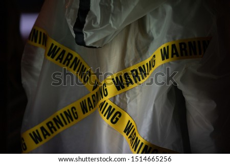 yellow ribbon with the inscription warning at the raincoat