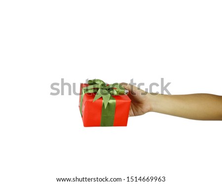 Hand of man with a red gift box isolated on white background and have clipping paths.