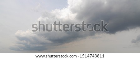 Panorama view of a nimbostratus cloud or nimbostratus is a multi-level, grey often dark, Cloudy before raining, Nature background. Royalty-Free Stock Photo #1514743811