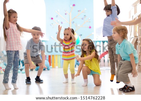 Preschool children group in day care centre. Active games for kindergarten kids Royalty-Free Stock Photo #1514762228